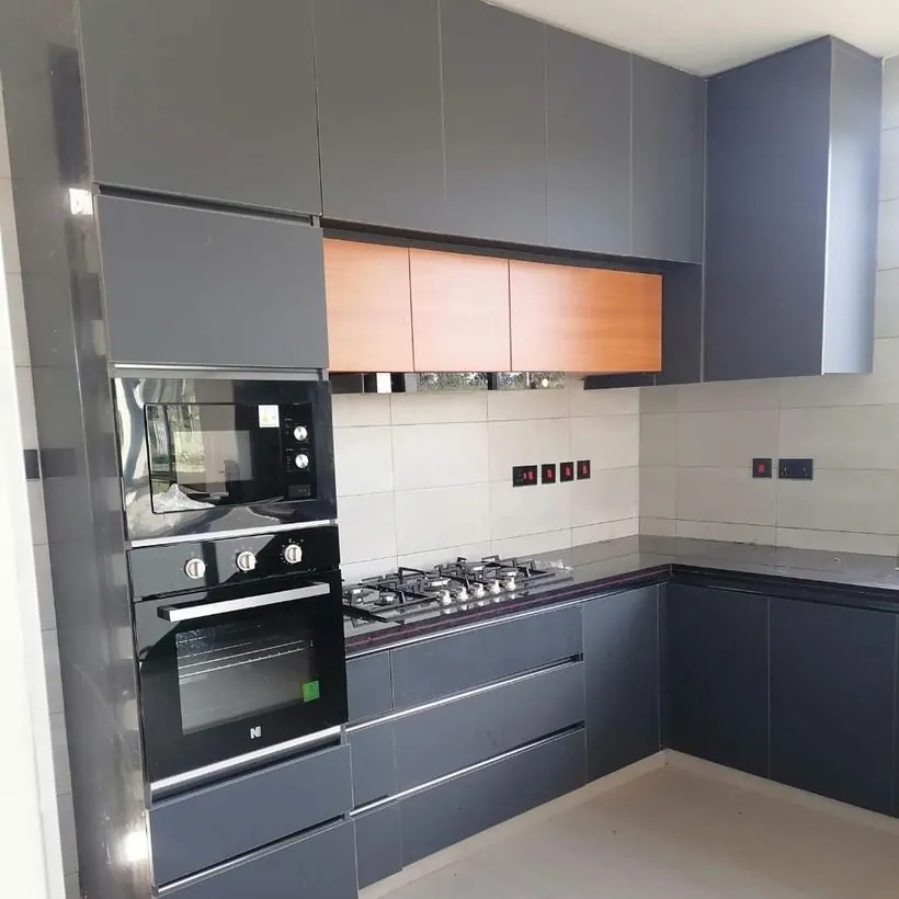 Finished kitchen by Kompact Interiors — cabinetry, worktops and appliances installed