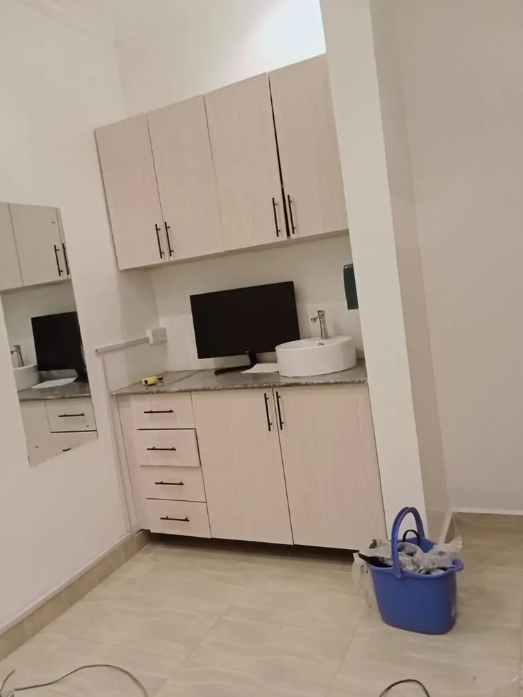 Bespoke cabinetry with worktop and sink
